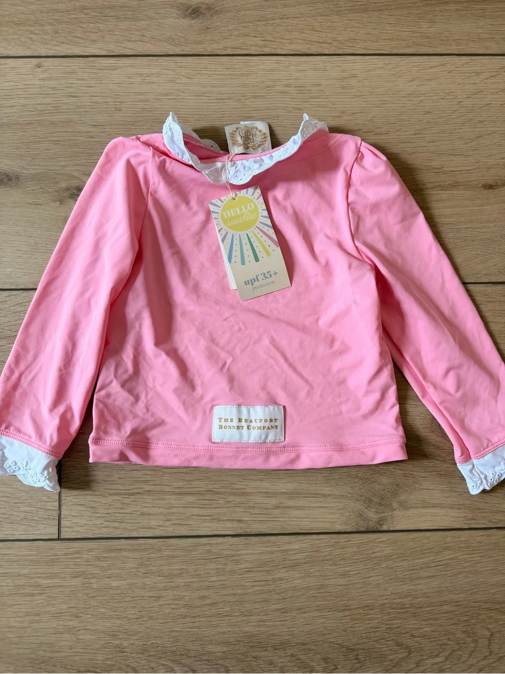 The Beaufort Bonnet Company Pink Kids Rashguard with White Lace Trim
